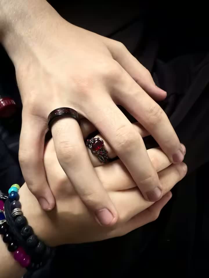 Two hands together, one wearing the Blood Vine Ring