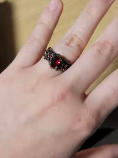 Blood Vine Ring worn on a hand in daylight