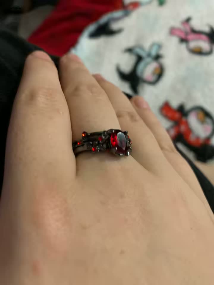 Close view of the Blood Vine Ring worn on a finger